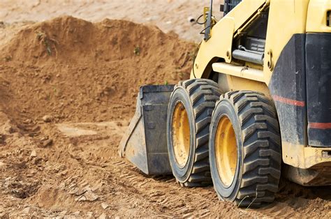 how to clear land with skid steer|skid loader moving tree video.